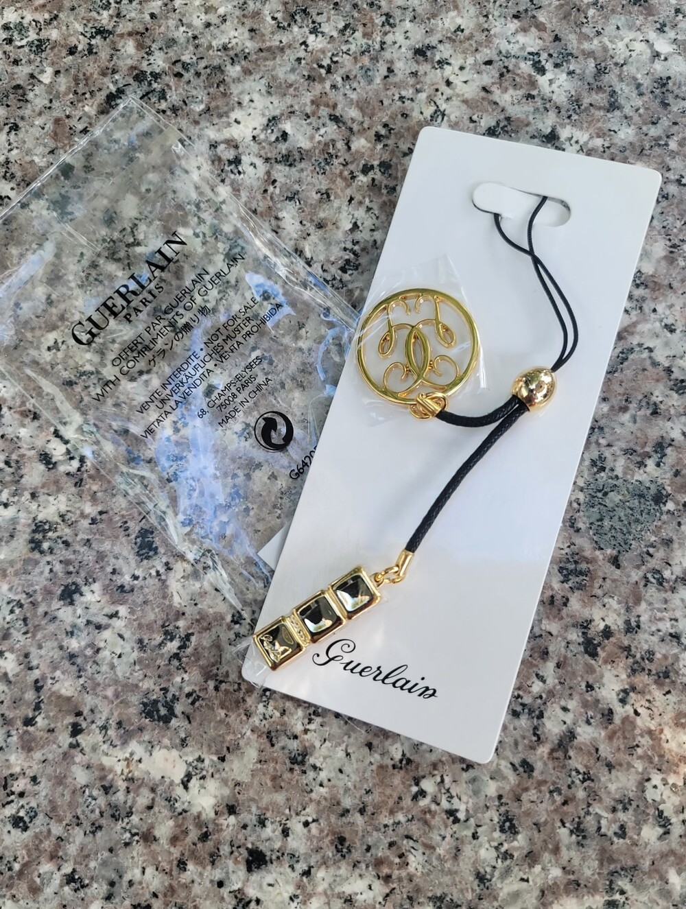 Guerlain bag charm